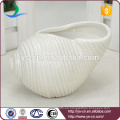 Yongsheng en relieve blanco Shell forma de cerámica Candle Holder para la decoración
